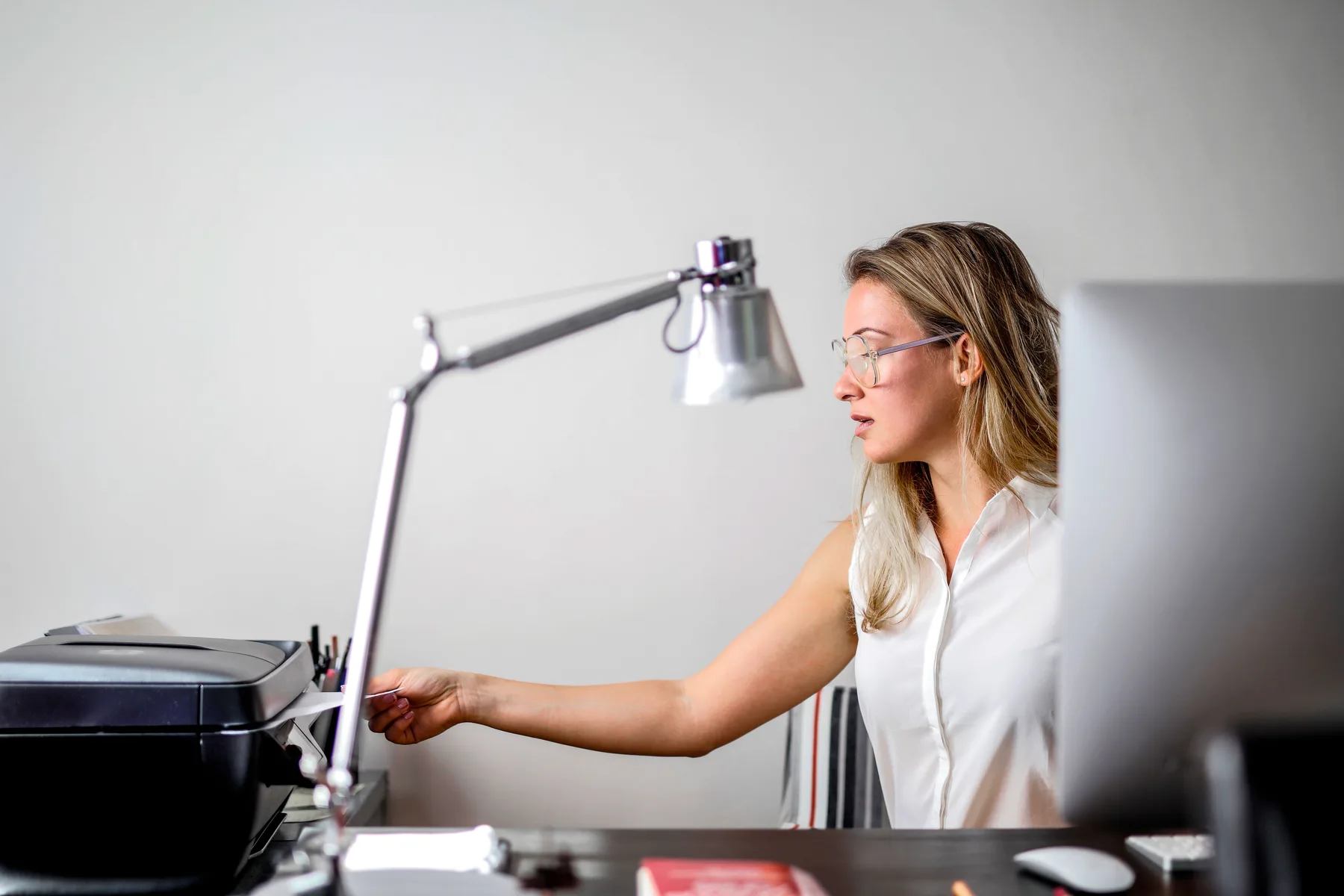 User setting up a printer in a professional workspace